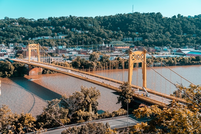 An aerial view of a town and a bridge.